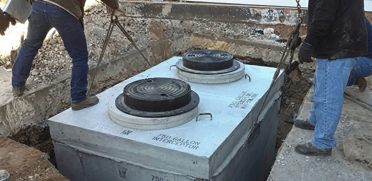 Grease trap installation for a commercial property drainage system in Kansas City, KS