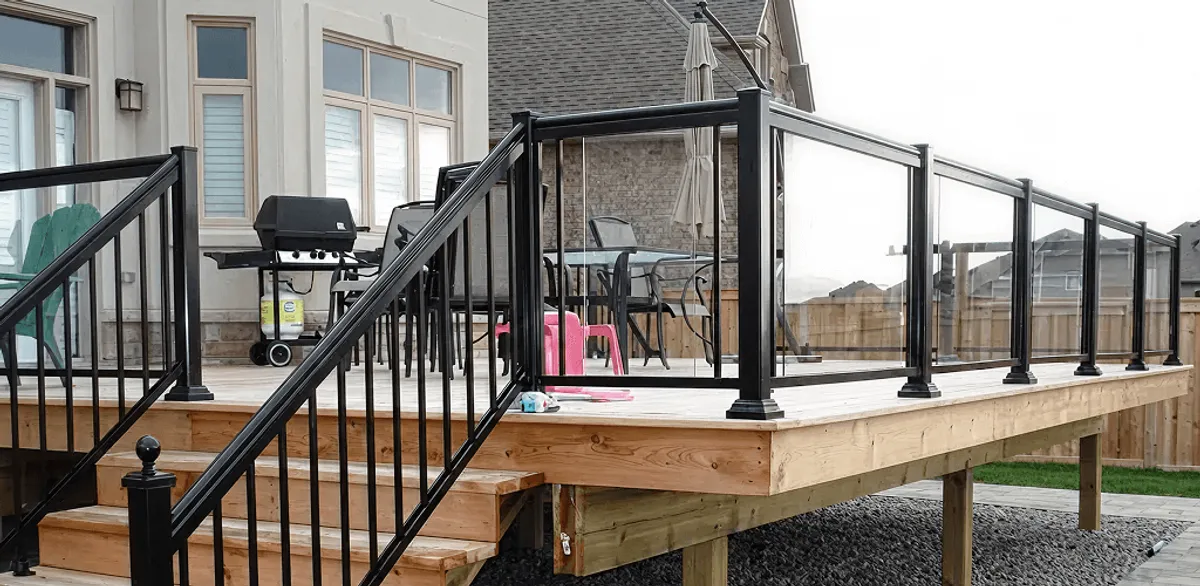 Handrail installation on a deck staircase for safety and code compliance in Kansas City, KS